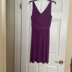 Fuschia color, stretch fabric polyester/spandex blend dress.